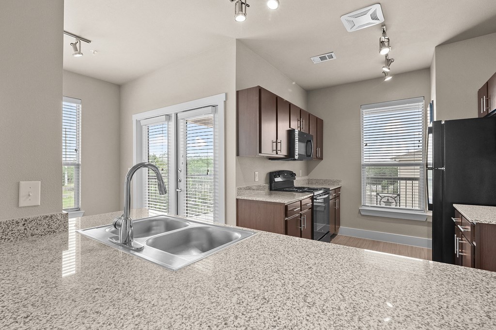 a kitchen with a sink and a window