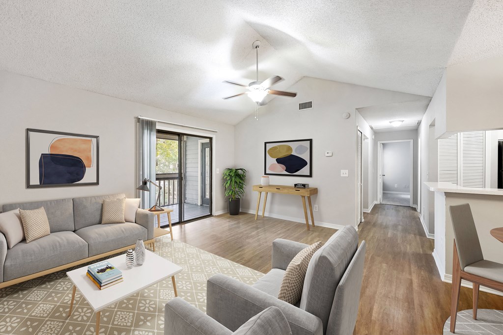 a living room with couches and a coffee table