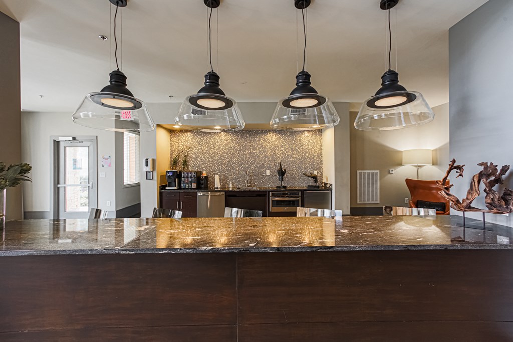 a view of the kitchen and living room from behind the bar