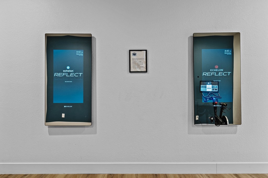 two signs on a wall in a room