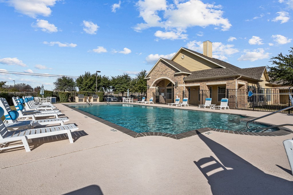 the swimming pool at the preserve at polo towers apartments