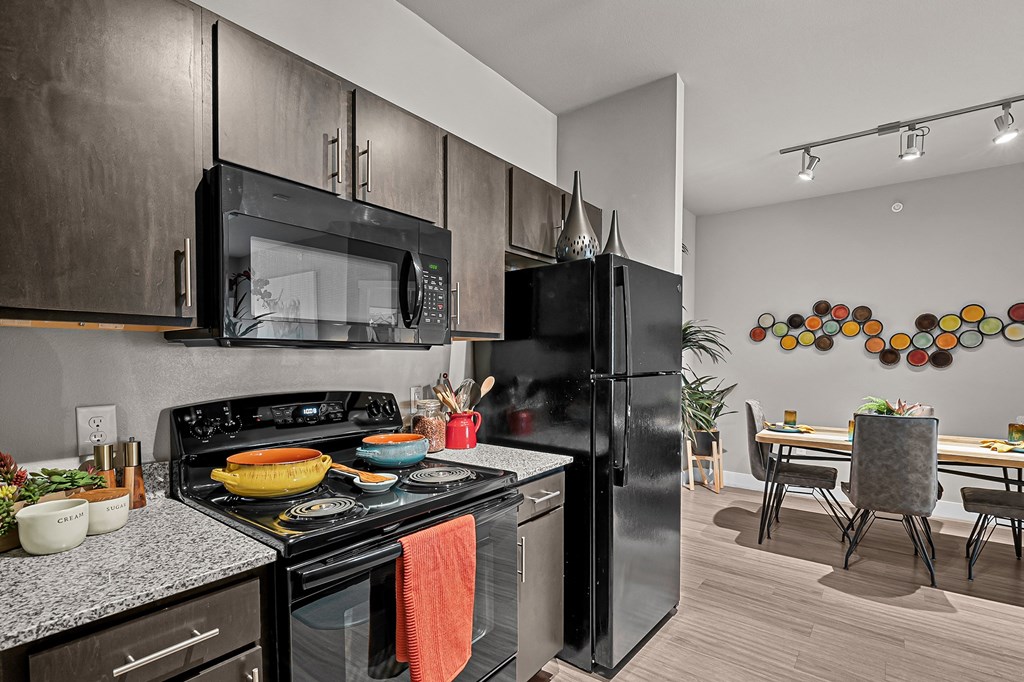 spacious kitchen and dining area at the district flats apartments in lenexa