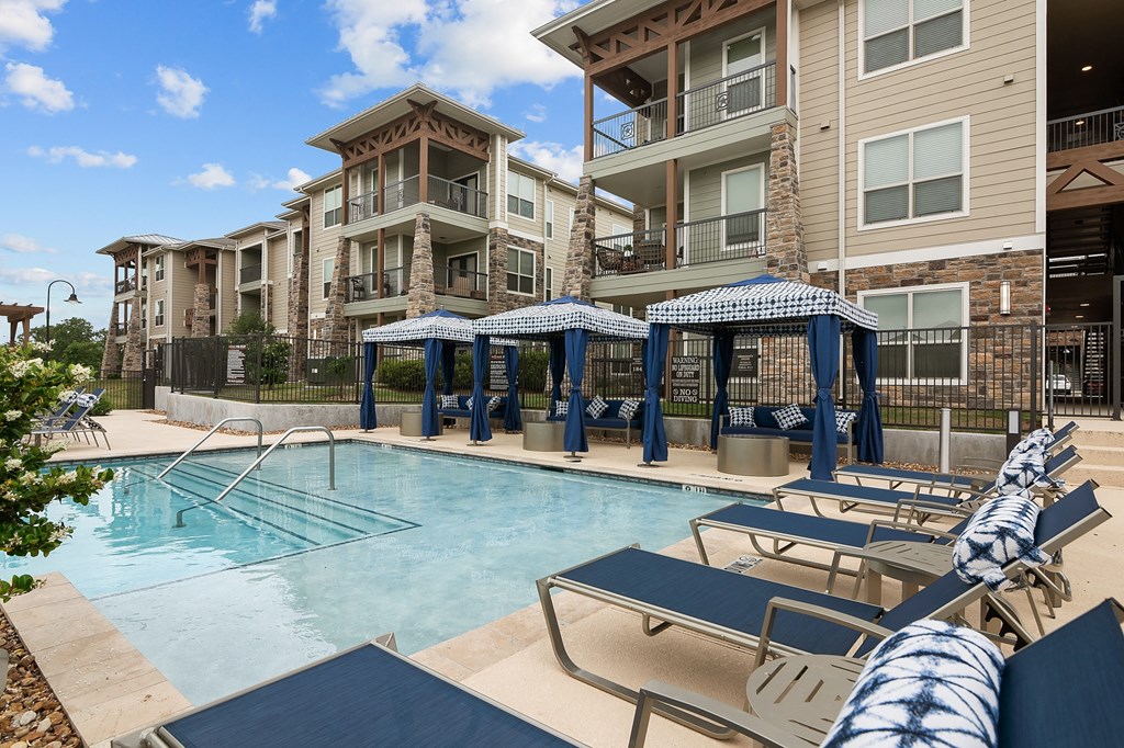our apartments have a large swimming pool with lounge chairs