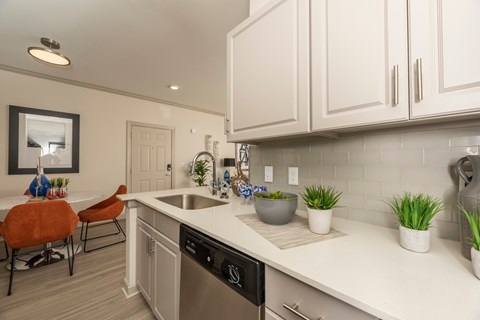 Kitchen with white cabinets at Woodbridge Villas Apartments, Sachse, 75048
