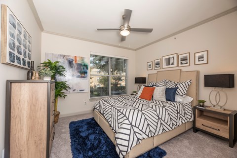 Bedroom with a bed at Woodbridge Villas Apartments, Sachse, TX, 75048