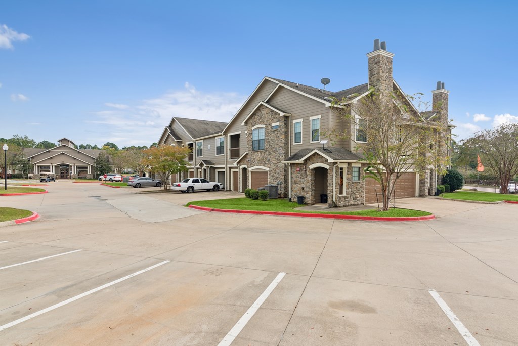 A large house with a driveway in front of it.