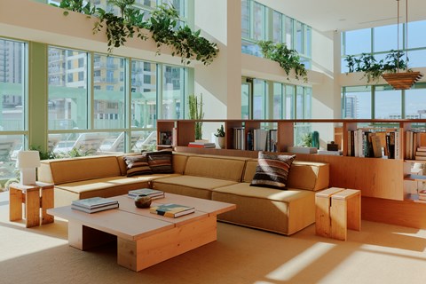 A living room with a large couch and a coffee table.