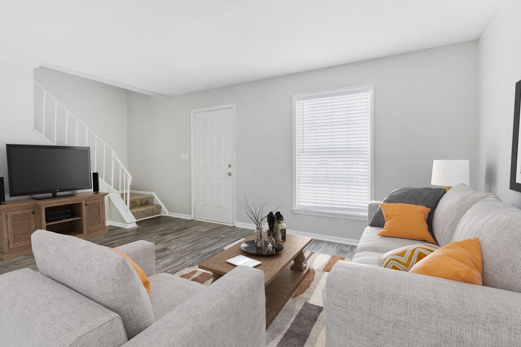 a living room with a couch and a tv