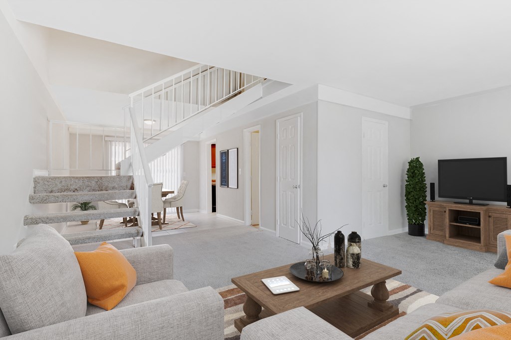 a living room with a couch and a tv