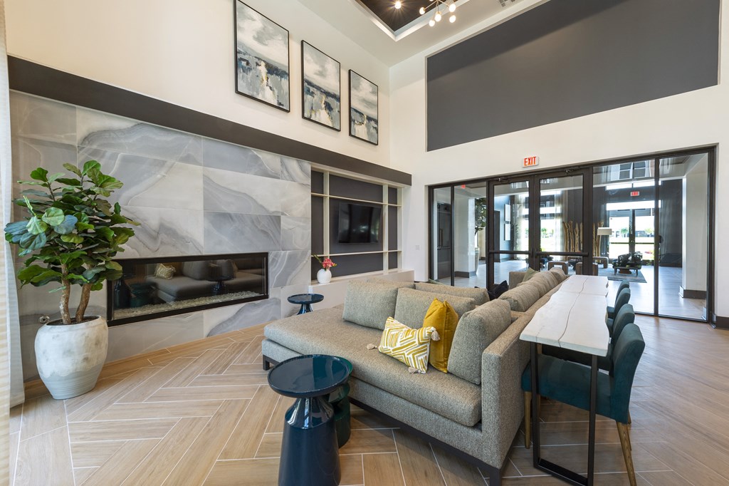 a living room with a couch and a table and a fireplace