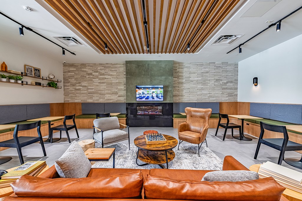 A living room with a fireplace and a television.