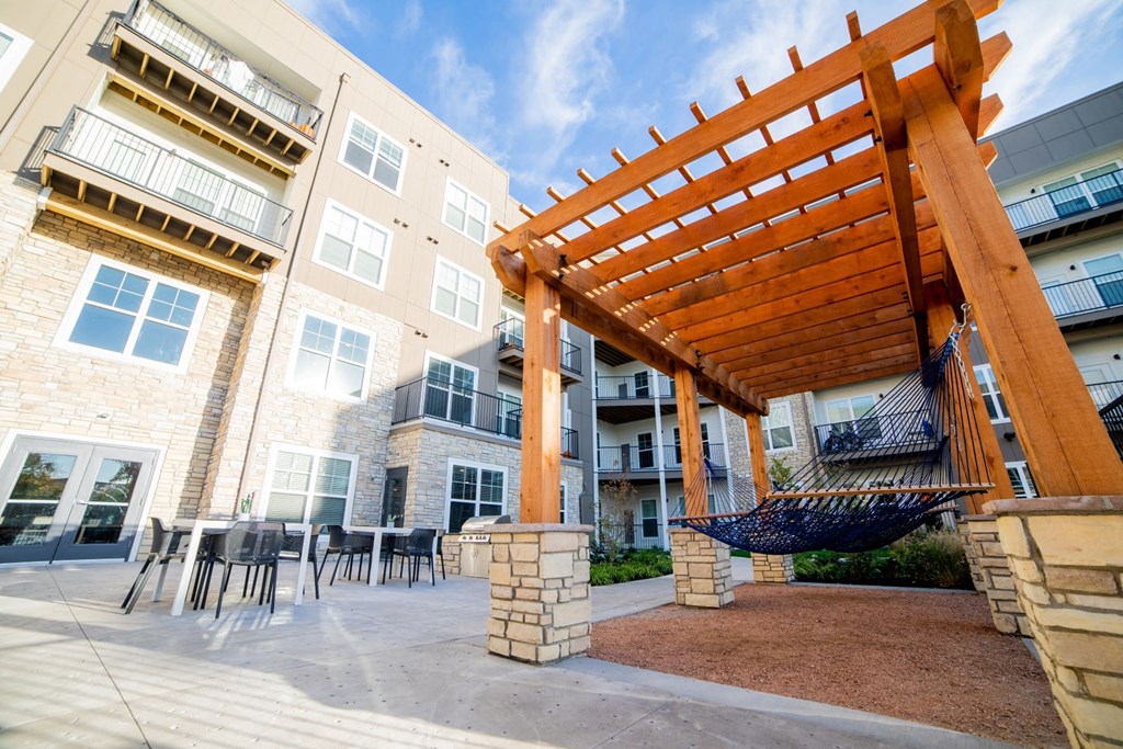image of patio and shaded courtyard outside of apartment building