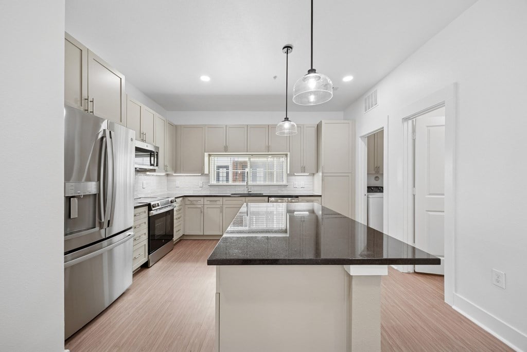 A modern kitchen with a large island in the center.