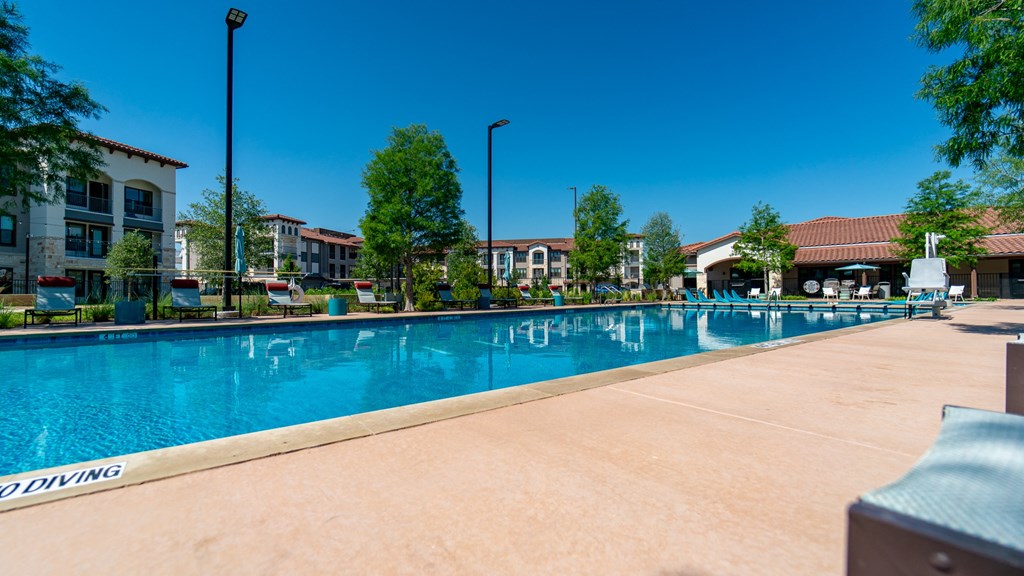 A large swimming pool with the words "NO DIVING" painted on the side.
