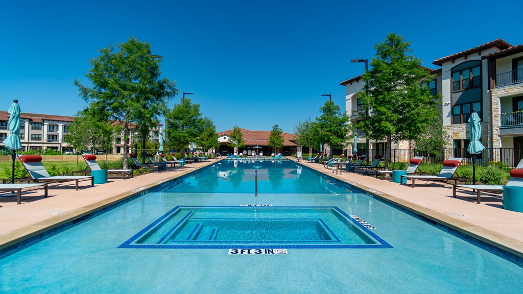 A swimming pool with the word "STONE" written on the bottom.