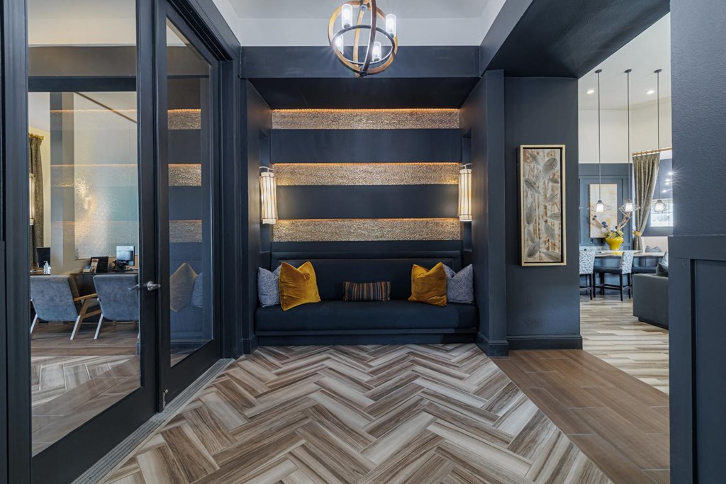 a living room with a couch and a checkered floor