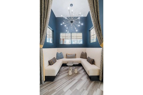 the living room has a large couch and a coffee table