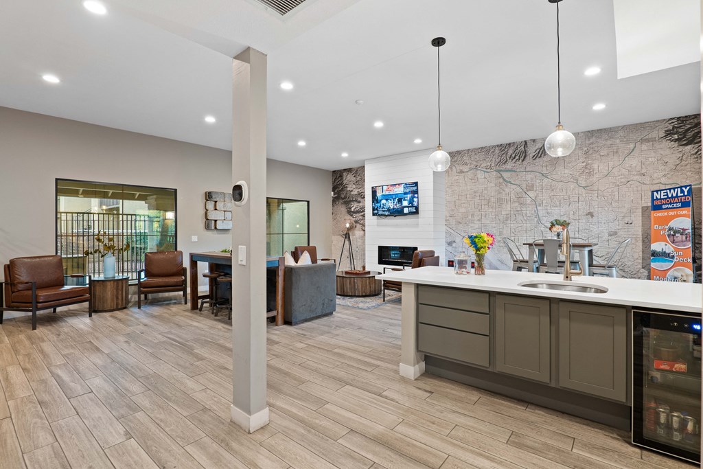 A modern office lobby with a reception desk and seating area.