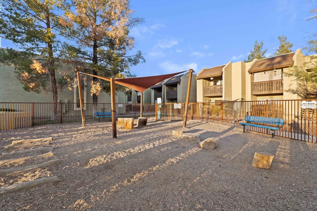 A playground with a swing set and a slide.