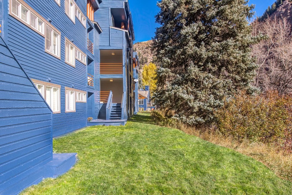 exterior image of the complex with green grass