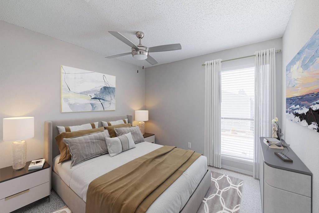 A bedroom with a bed, nightstand, and a painting on the wall.