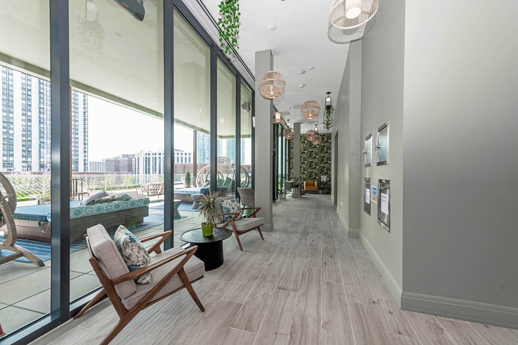 A living room with a view of the city through the windows.