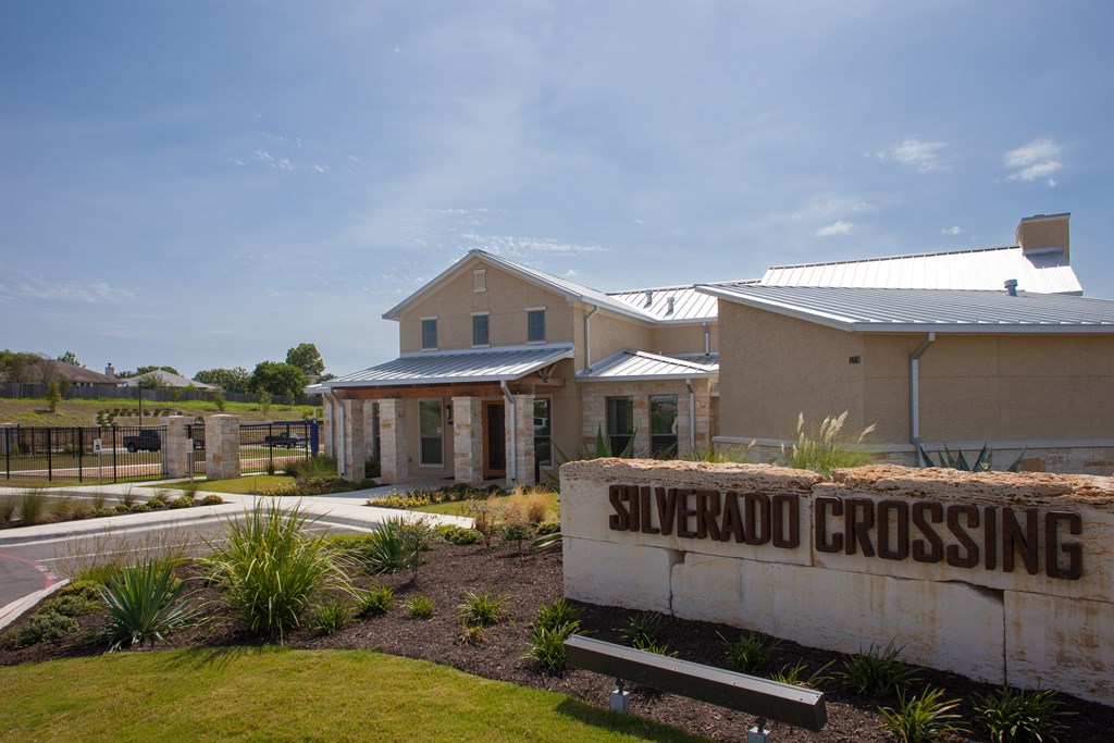 A building with a sign that says Silverado Crossing in front of it.