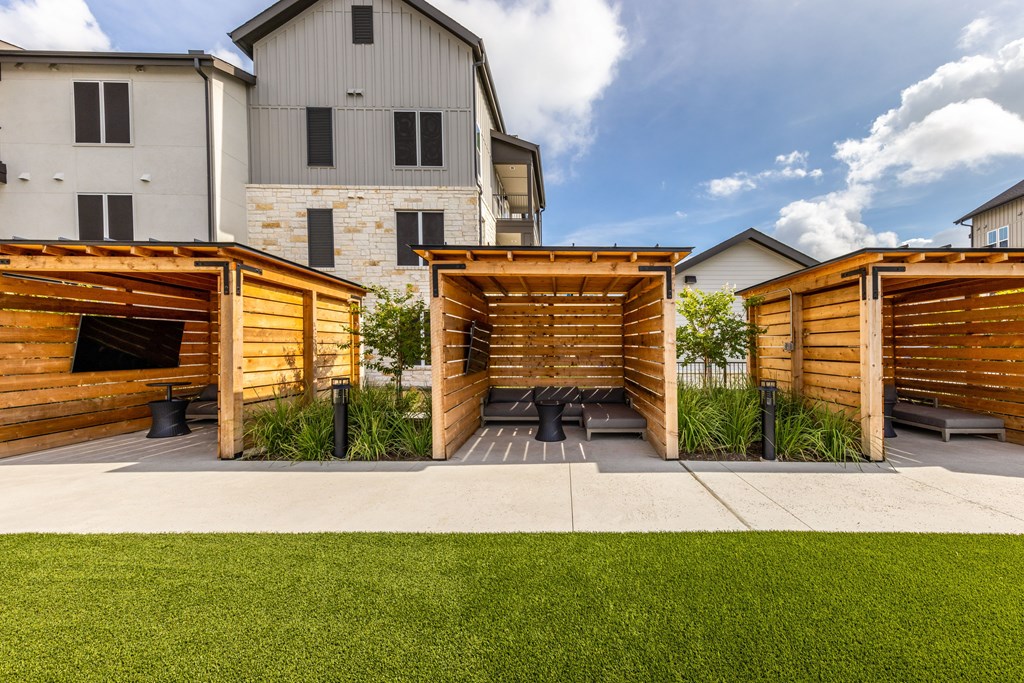 A modern house with a wooden garage door.