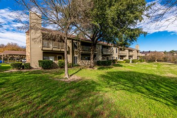 exterior shot of building during the day in austin texas apartments - Photo Gallery 11