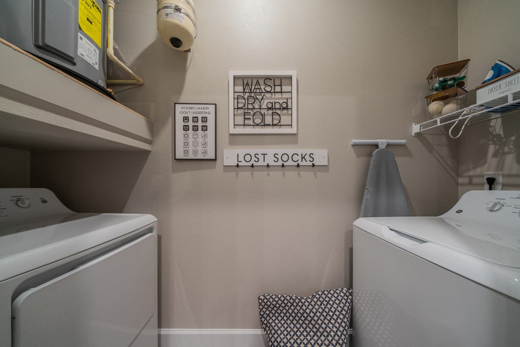 a laundry room with a washer and dryer