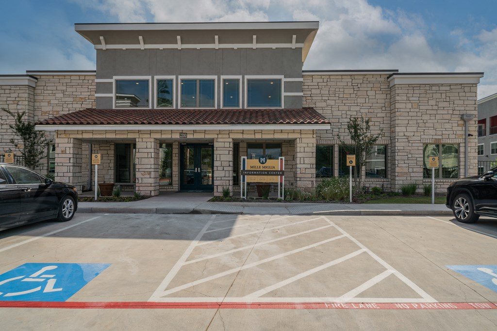 a building with a parking lot in front of it