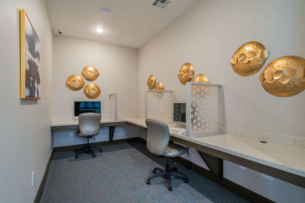 a view of a room with computers and gold balls on the wall