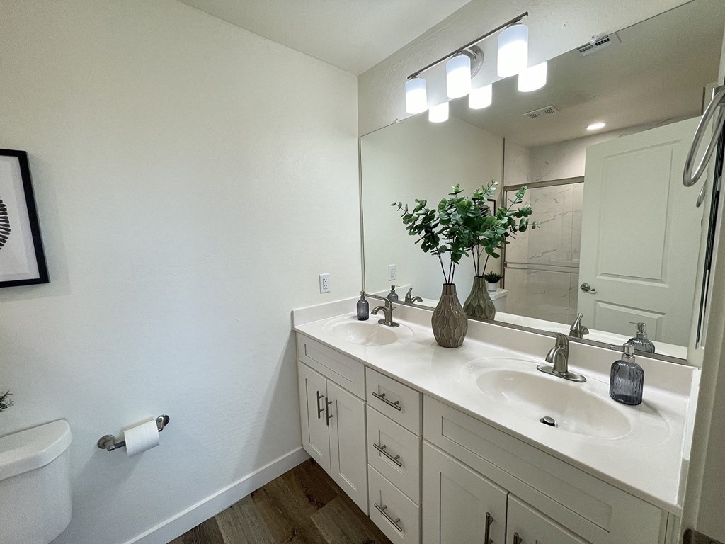 an empty bathroom with a sink and a mirror
