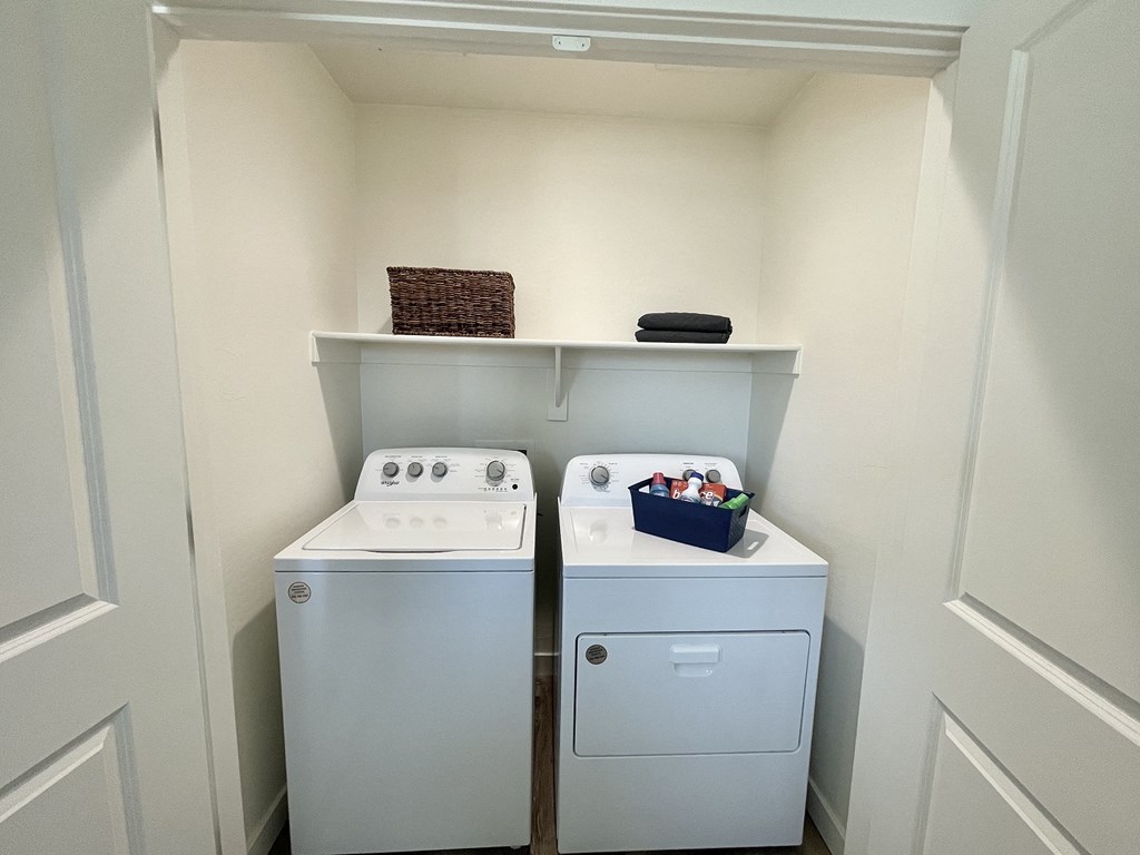 a small laundry room with a washer and dryer