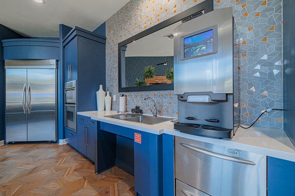 a kitchen with a refrigerator freezer and a sink