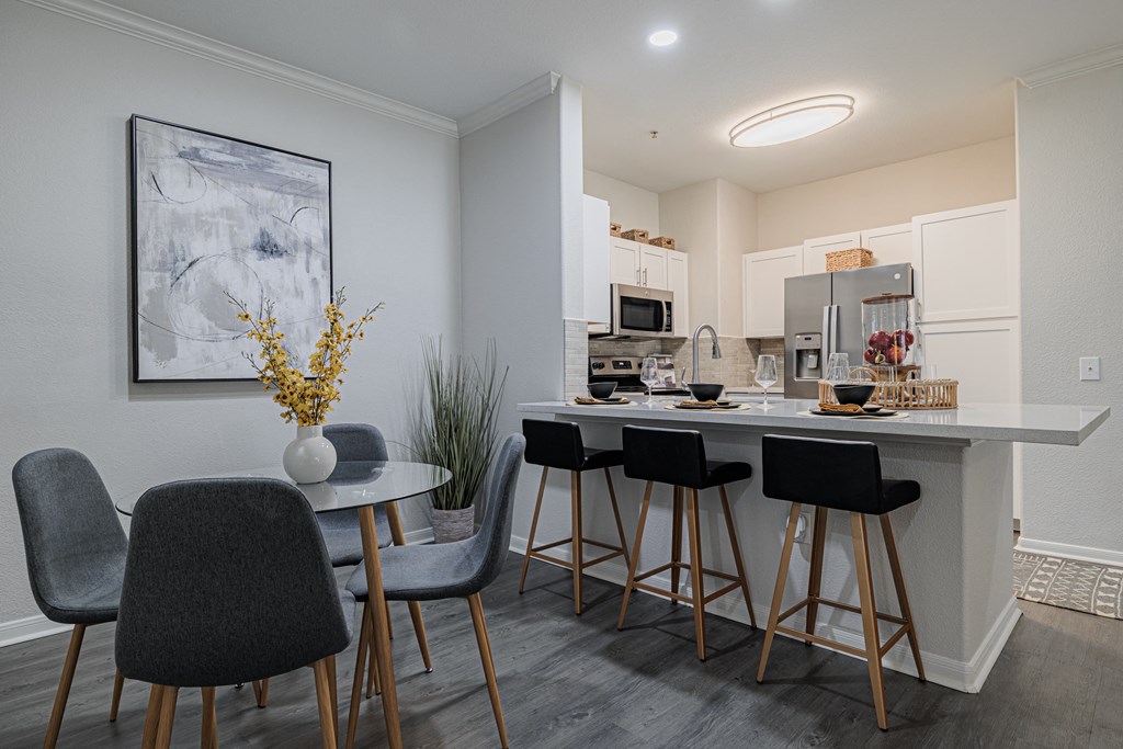 a kitchen and dining area in a 555 waverly unit