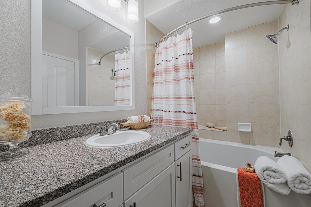 a bathroom with a sink and a bathtub
