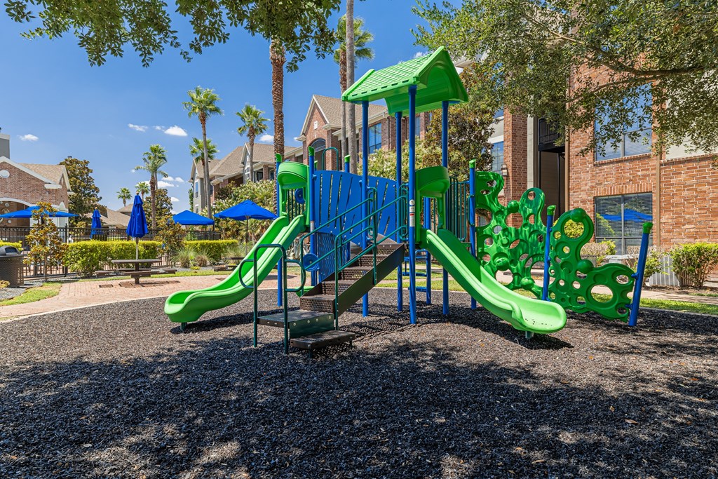 a playground at the whispering winds apartments in pearland, tx
