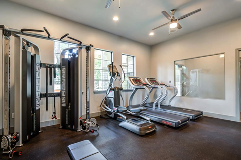 the gym is equipped with treadmills and other fitness equipment