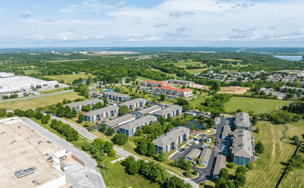 an aerial view of a city with houses and trees