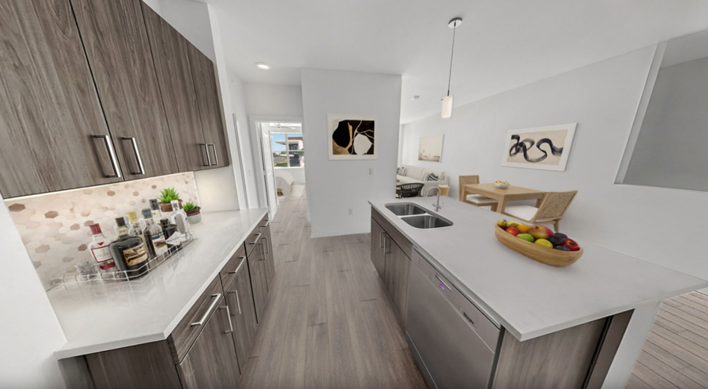 a kitchen with a sink and a counter top in a house