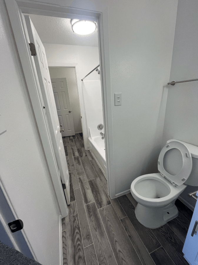 a small bathroom with a toilet and a shower