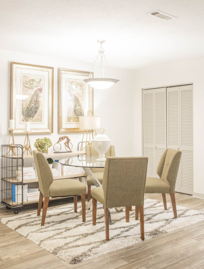 a dining room with a table and chairs