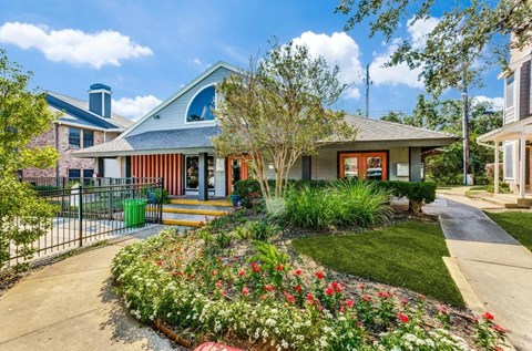 A house with a front yard and a fence.