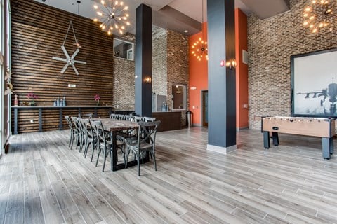 a dining room with a table and chairs and a pool table