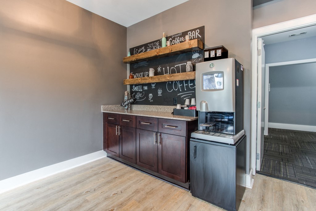 a kitchen with wooden cabinets and a refrigerator and a counter top