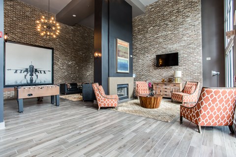 a living room with a tv and a fireplace