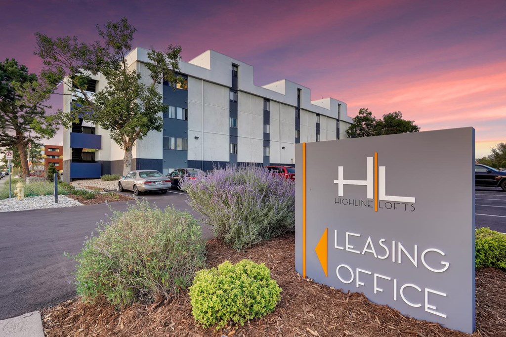 a building with a leasing office sign in front of it