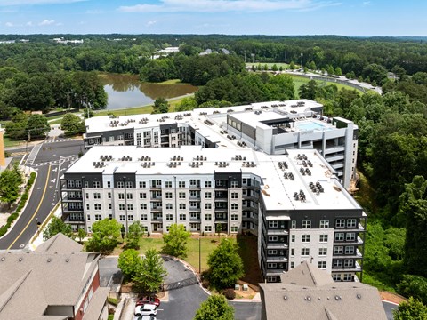 A large building with a parking lot in front of it.