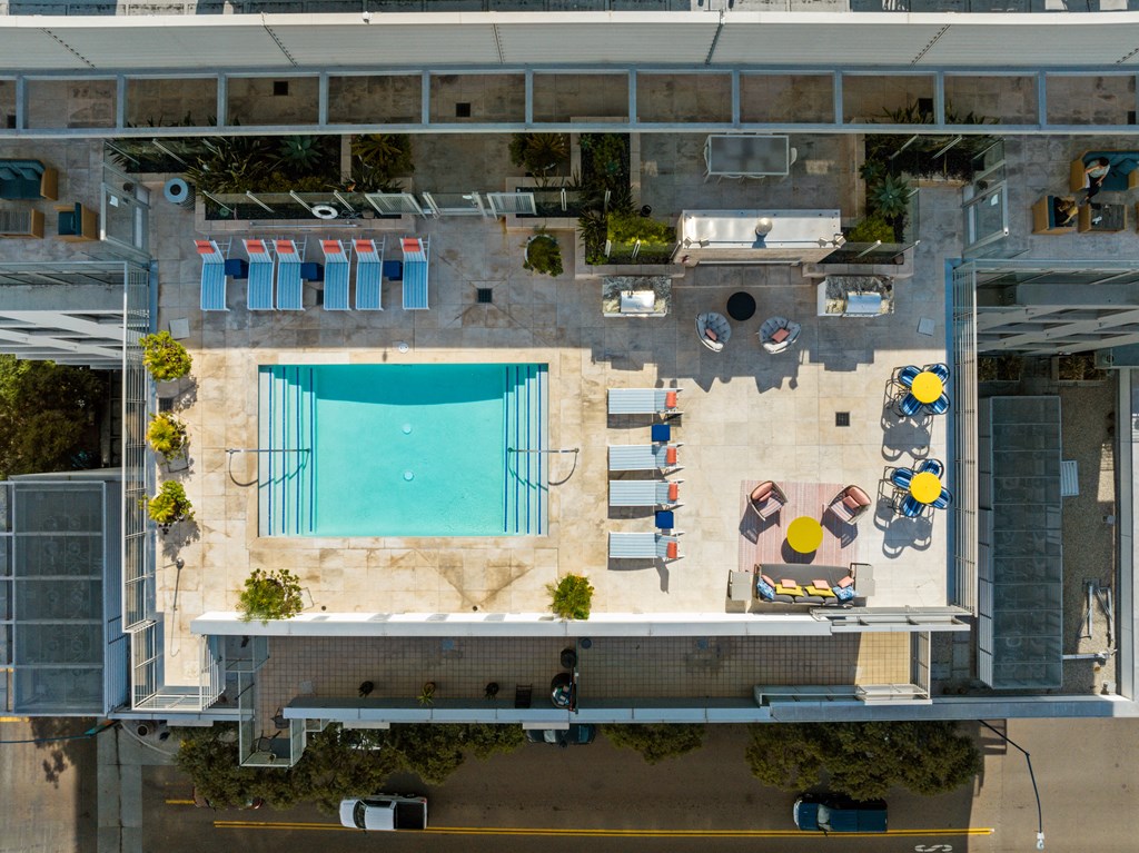 an aerial view of a pool on the roof of a building